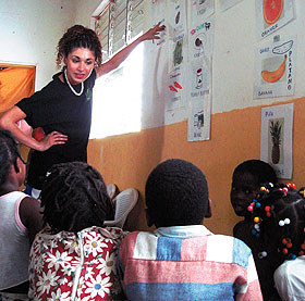 Adaliss Rodriguez, a sophomore, teaches children about food groups in Batey Campo Nuevo in the Dominican Republic.