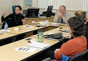 Clockwise from left, Ph.D. student Lily Alpert, a TA in family studies, Professor Keith Barker, and Ph.D. students Sadie Smith, animal science, and Lara Watkins, anthopology, discuss teaching strategies.