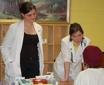 Medical student Jessica Johnson, left, and nursing graduate student Kara O’Brien offer health advice at the Parkville Senior Center in Hartford during National Primary Care Week last month.