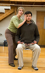 Elizabeth Huebner teaches the Alexander Technique to Luke Daniels, a drama student in the master of fine arts program.