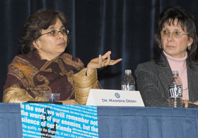 Manisha Desai, left, director of women’s studies, answers a question during a Martin Luther King Jr. panel discussion at the Student Union Theatre Jan. 30. At right is Davita Glasberg, head of the sociology department.