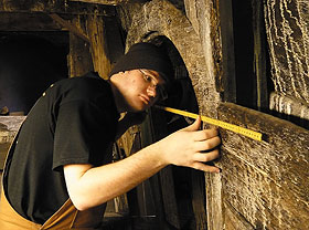 Student Eric Heffter takes measurements of the Vasa warship in Stockholm. 