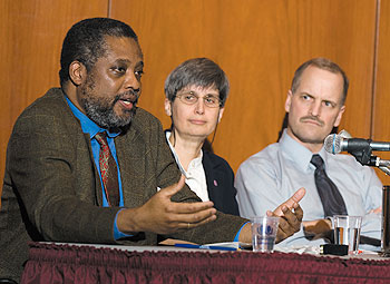 Norman Garrick, left, associate professor of civil and environmental engineering, speaks during a climate change awareness event Jan. 31. Other panelists shown are Brenda Shaw, associate professor of chemistry, and David Wagner, professor of ecology and evolutionary biology.
