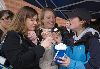 From left, Kristina Jablonski, a freshman pre-teaching major, Cara Flynn, an exploratory freshman, and Annemarie Hovasse, a sophomore psychology major, enjoy an ice cream at the SUBOG One Ton Sundae event, Feb. 8.