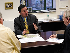 Mun Choi, dean of engineering, meets with John Bennett, associate dean, left, and Marty Wood, assistant dean.