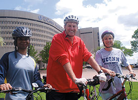 Dr. Lori Wilson, assistant professor of surgery, men’s basketball coach Jim Calhoun, and Nancy Baccaro, a nurse practitioner, took part in a rally last spring to promote the Jim Calhoun Challenge Ride.