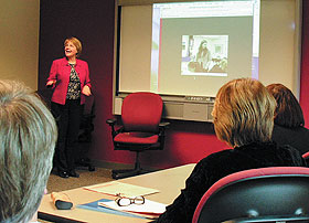 Marijke Kehrhahn, director of teacher education in the Neag School of Education, demonstrates TaskStream, a web-based program, to a group of visitors from the education school at the University of Auckland, New Zealand. 