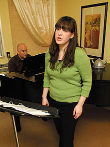 University Scholar Julienne Pendrys is coached in singing by Professor Constance Rock, not shown, and Allan Conway, adjunct instructor, at the piano.