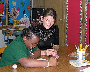 Teacher education student Kelsey Seddon, a junior in the Neag School of Education's integrated bachelor's/master program, works with Dahazia Stewart, a fourth-grader at Batchelder Elementary School in Hartford.