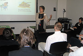 Kathleen Dechant, professor-in-residence of management, leads a discussion about globalization during a conference for high school students at the Stamford Campus on March 26. 