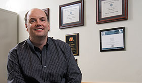 John Mathieu, the Robert Cizik Chair in Manufacturing and Technology Management, in his office at the School of Business.