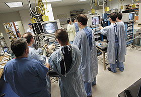 Physicians training to be orthopaedic surgeons practice their skill with the arthroscope in the Bioskills Laboratory at the Health Center’s New England Musculoskeletal Institute, under the supervision of Dr. Augustus Mazzocca, far left.