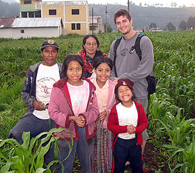 Max Chanoch poses with a farming family in a field outside Quetzeltenango in western Guatemala. 