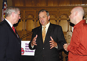 Richard Schwab, center, dean of the Neag School of Education, speaks with Dennis Van Roekel, left, president of the National Education Association, and Barry Fargo, a New London teacher, after a press conference at the state Capitol Sept. 8.