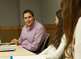 Christopher Hattayer ‘02, speaks with students at the Student Union