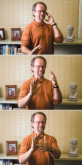 Harry van der Hulst, professor of linguistics, demonstrates the sign for “recognize” in American Sign Language. He is conducting research on sign languages from around the world.