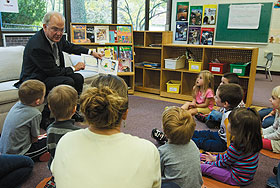 University President Michael J. Hogan reads the story of Corduroy to pre-schoolers at the Child Development Laboratories as part of Jumpstart’s Read for the Record event on Oct. 2.