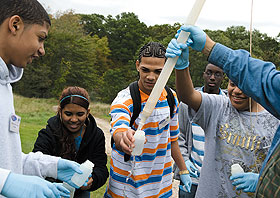 From left Juan Antonio Soto, Francheska Gonzalez, Rafael Rivas, Troy Alexander, and Luis Hernandez, all high school students, collect well water samples during Environmental Action Day Oct. 3.
