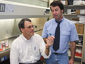 Dr. Frank Nichols, left, and Dr. Robert Clark in their lab at the Health Center.