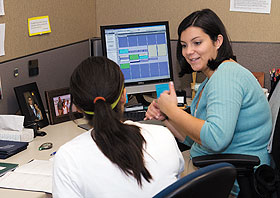 Graduate assistant Laura Rowley, right, a student in the special education master’s program, tutors a student at the Center for Students with Disabilities in Wilbur Cross Building.