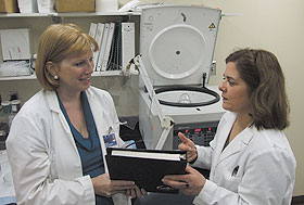 Dr. Cheryl Oncken, left, headed a team studying the use of nicotine gum by pregnant women who smoke. Also shown is research assistant Pam Ferzacca.