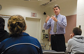 William Madaus, associate professor of educational psychology, teaching a class in the Gentry Building.