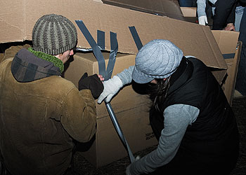Students set up a cardboard box 'home' for a sleepout on Dow Field on Nov. 18, part of a week of activities to raise awareness of homelessness.