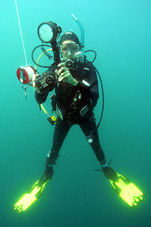 Graduate student Anya Watson 'hangs' at 15 foot depth to make a safety stop on the way to the surface to avoid decompression sickness after a dive at Gray's reef National Marine Sanctuary off the coast of Georgia.