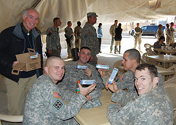 Rep. Joe Courtney (D-2nd District) shares Munson's UConn Husky chocolate bards with U.S. soldiers during a visit to Iraq in December.