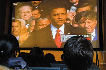 Students watch as Barack Obama takes the presidential oath of office on Jan. 20. The Student Union Theatre was one of a number of locations on campus that offered public screenings of the Inauguration.