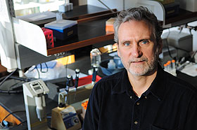 David Butler, a recent Ph.D. graduate, at his lab in the Pharmacy/Biology Building.