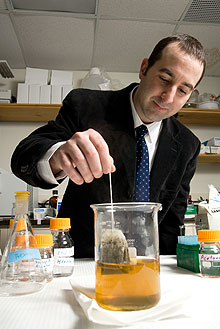 Nutritional scientist Richard Bruno works with green tea in his lab in the Jones Building.