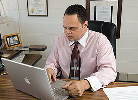 Rick Hancock, assistant professor-in-residence of journalism, works on his computer.