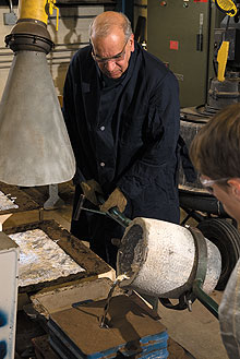 Harold Brody, Distinguished Professor of Materials Science and Engineering, works with liquid aluminum in his lab.