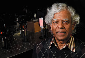 Physics professr Chandra Roychoudhuri in his lab at the Depot Campus. 