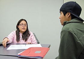 Andrea Tovar, a senior majoring in psychology and Spanish, discusses test-taking skills with Erick Desingco, a freshman pre-pharmacy major, in the new Academic Achievement Center in the CUE Building.
