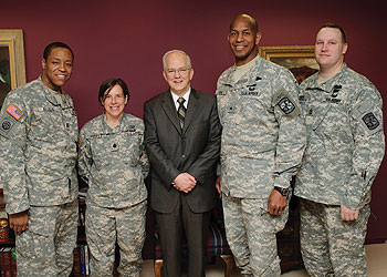 From left, Capt. Herman Bulls, U.S. Army Cadet Command; Lt. Col. Christine Harvey, professor of military science; President Michael Hogan; Brig. Gen. Arnold Gordon-Bray, deputy commanding general, U.S. Army Cadet Command; and Sgt. Daniel Pinion, senior military instructor, after a coin presentation to the President.