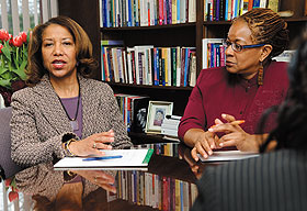 Salome Raheim, left, dean of the School of Social Work, meets with representatives from the University of the West Indies, including Peta-Anne Baker, in her office at the Greater Hartford Campus. 