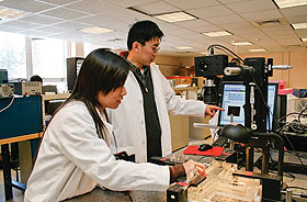 Wei Sun, right, assistant professor of biomedical engineering and mechanical engineering, and graduate student Thuy Pham.
