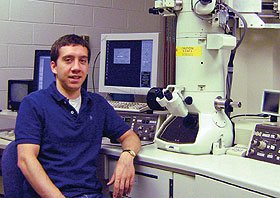 Jonathan Winterstein with a transmission electron microscope.