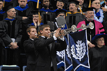 Trumpeters herald the arrival of the platform party at the Graduate Commencement ceremony held in Gampel Pavilion on May 9.