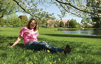 Kaitlin Heenehan, Class of 2011, an ecology and evolutionary biology major, relaxes beside Mirror Lake.