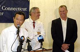 Image: Dr. Bruce Liang, Dr. Peter Deckers, and Coach Jim Calhoun