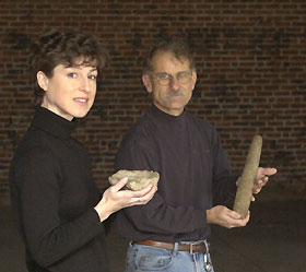 Image: Leanne Harty and Nicholas Bellantoni hold artifacts from the University's archaeology collections.