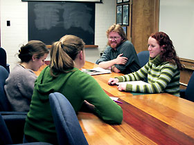 Image: Graduate students speak with the program coordinator of the joint bachelor's/master's degree program in biodiversity and conservation biology.