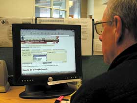 Image: David McChesney demonstrates the online reference service.