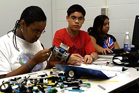 Students work on a robotic car.