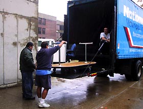 Image: Movers unload their truck