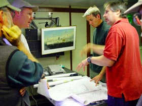 Image: Researchers discuss plans for a dive to locate the wreck of the Portland.