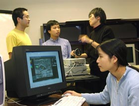 Image: Quing Zhu with graduate assistants